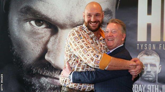 Tyson Fury hugs Frank Warren