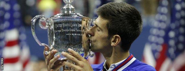 Novak Djokovic kisses the US Open trophy