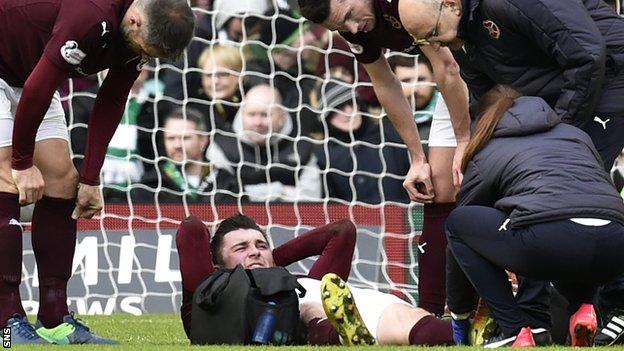 Hearts' John Souttar lies injured at Celtic Park