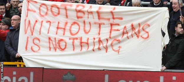 Liverpool fans display a banner