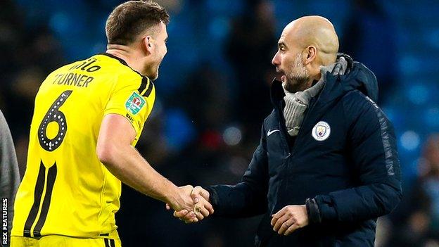 Ben Turner shaking hands with Manchester City manager Pep Guardiola