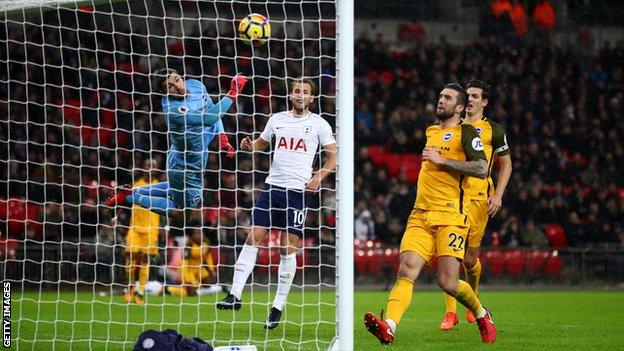 Serge Aurier (in the background, on the floor) scores for Tottenham