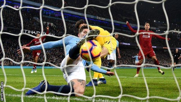 John Stones clears the ball off the line against Liverpool in January 2019