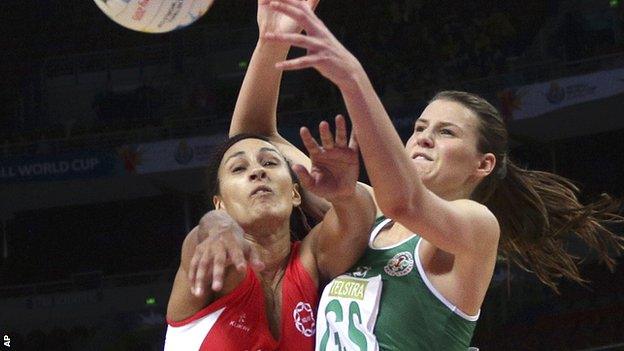 England's Geva Mentor (left) and Wales goal shooter Georgia Rowe battle for the ball