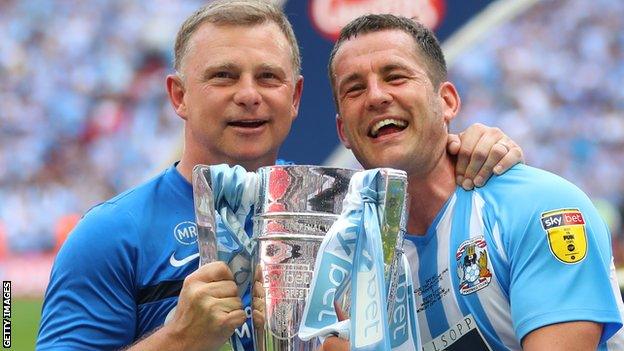 Coventry City manager Mark Robins with captain Michael Doyle