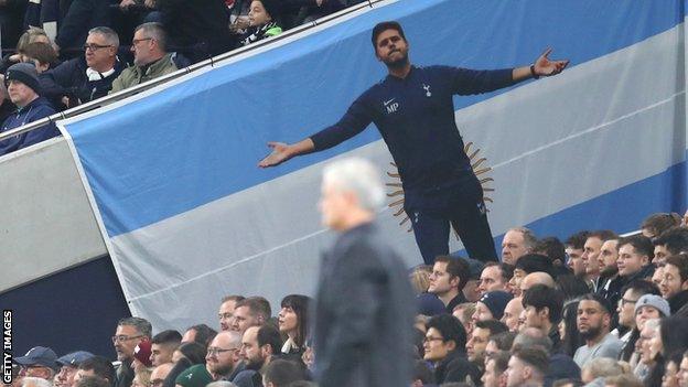 A Pochettino flag overlooks Mourinho