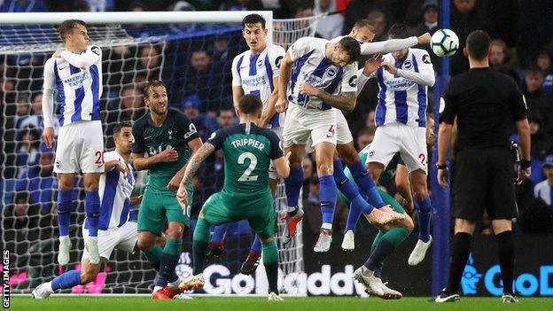 Kieran Trippier's free-kick is blocked by Glenn Murray's arm