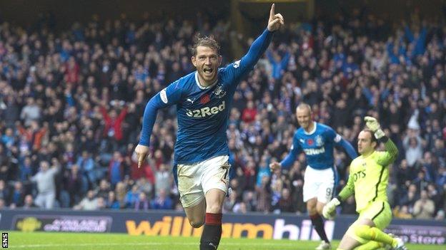 Joe Garner celebrates scoring for Rangers