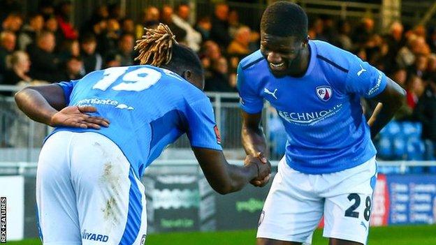 Saidou Khan (right) celebrates a Chesterfield goal with team-mate Kabongo Tshimanga