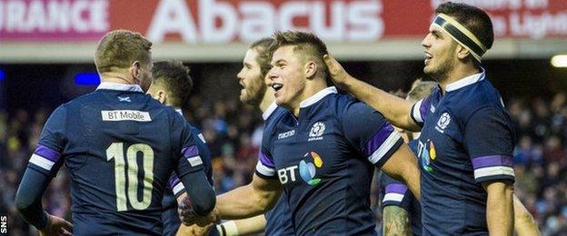 Scotland players celebrate a Huw Jones try