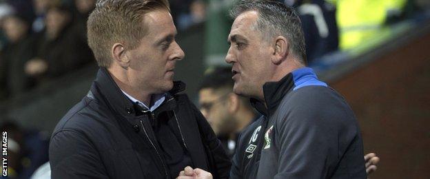 Garry Monk and Owen Coyle shake hands