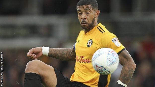 Joss Labadie grimaces as he controls a high bouncing ball