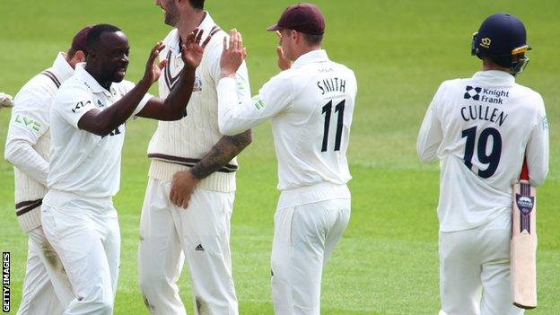 Kemar Roach celebrates the wicket of Blake Cullen