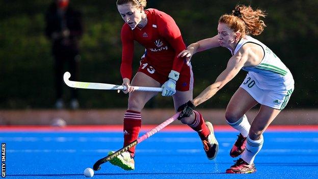 GB's Ellie Rayer is beaten to the ball by Sarah McAuley in the Belfast match