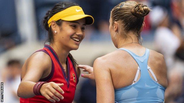 Emma Raducanu shakes hands with Shelby Rogers after their US Open last-16 match