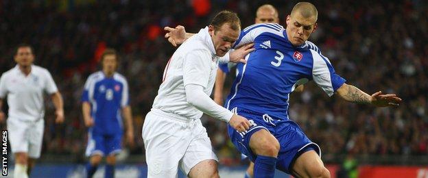 Wayne Rooney (left) and Martin Skrtel faced each other when England and Slovakia met in a 2009 friendly