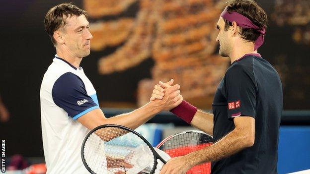 John Millman (left) and Roger Federer