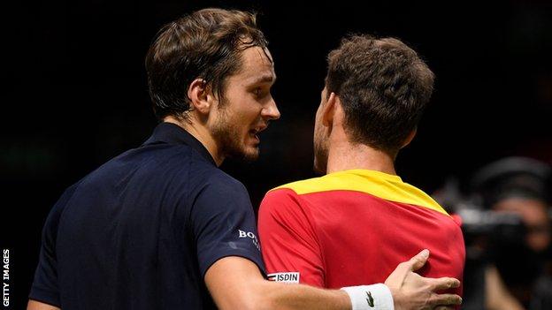 Daniil Medvedev hugs Pablo Carreno Busta after his Davis Cup win