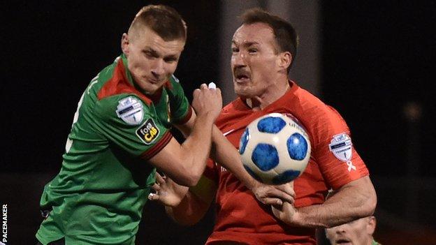 Glens striker Andrew Mitchell and Albert Watson battle for possession