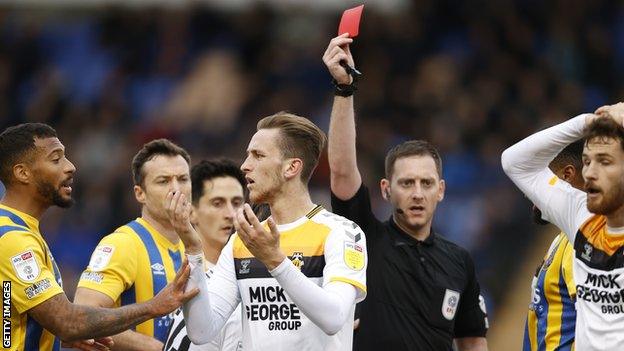 Adam May is sent off