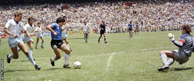 Maradona scores past Peter Shilton for Argentina against England