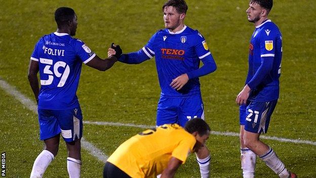 Colchester celebrate their fifth goal