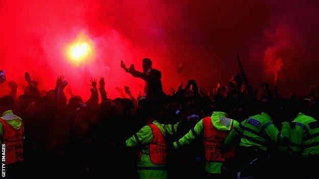 Liverpool fans light flares before the Champions League semi-final with Roma at Anfield