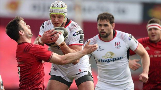 Darren Sweetnam tackles Ulster's Luke Marshall during the first half in Limerick