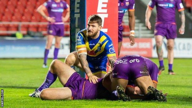 Warrington's Daryl Clark scores his first try against Huddersfield