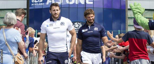 Scotland pair Tommy Seymour (left) and Ross Ford make their way out to the training pitches at Murrayfield