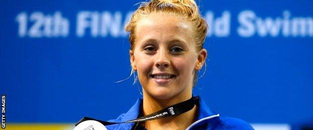 Siobhan-Marie O'Connor of Great Britain poses with her silver medal after finishing second in the Women's 100m Individual Medley Final on day three of the 12th FINA World Swimming Championships