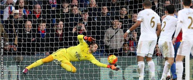 Lukasz Fabianski saves from Brede Hangaland