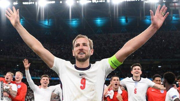 Harry Kane celebrates with England fans