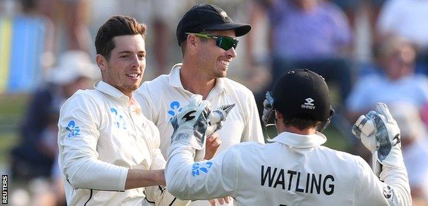 Mitchell Santner celebrates one of his wickets