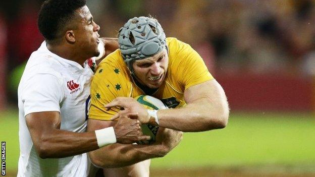 England's Anthony Watson tackles David Pocock