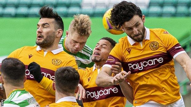 Motherwell players heading the ball