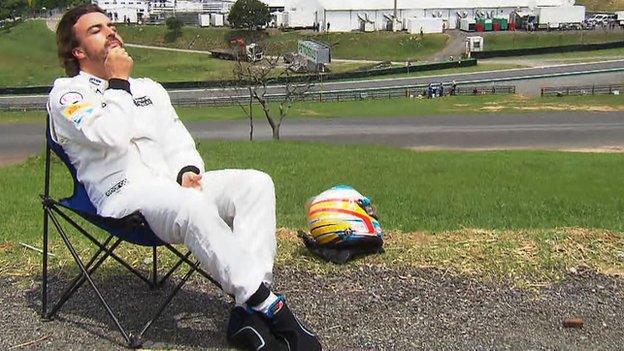 Fernando Alonso sunbathing at Interlagos