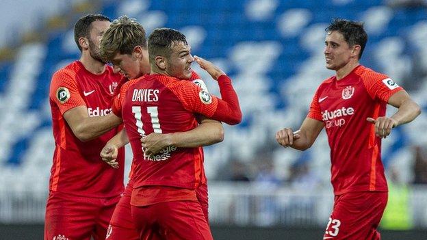 Tom Moore celebrates with team-mates after scoring for Connah's Quay