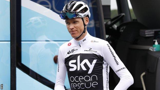 Team Sky rider Chris Froome steps off the team bus before a training session