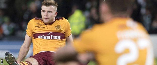 Chris Cadden is dejected after 10-man Motherwell lose the Scottish League Cup final to Celtic