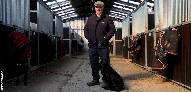 Colin Tizzard on the family farm with his dog Snipe