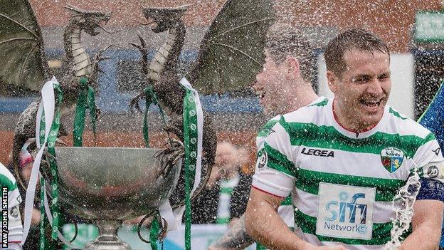 Chris Marriott celebrates with the trophy