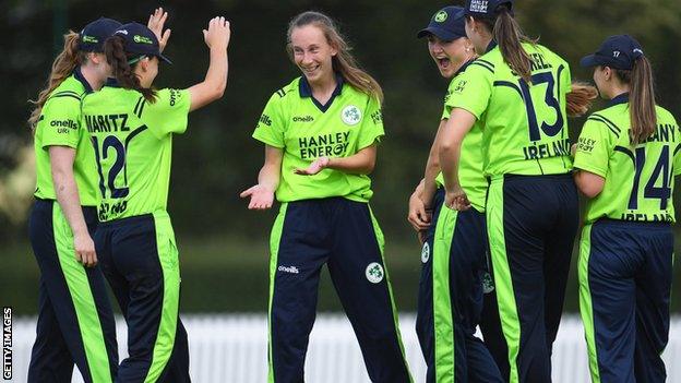 Ireland celebrate a wicket by Orla Prendergast