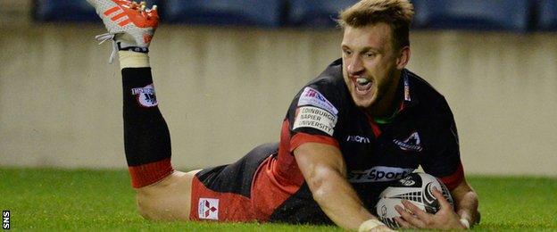 Tom Brown slides over one of his second-half tries