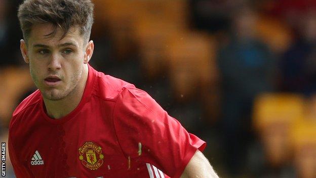 Joe Riley in action for Manchester United's Under-21 side