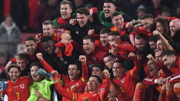 Wales players celebrate after securing Euro 2020 qualification