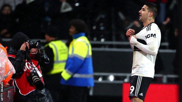 Aleksandar Mitrovic celebrates his goal for Fulham against Brighton in the Premier League.