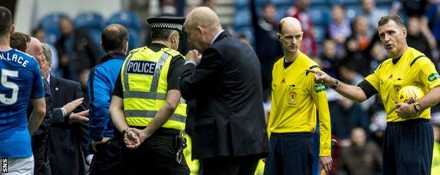 Falkirk manager Peter Houston argues with referee John McKendrick