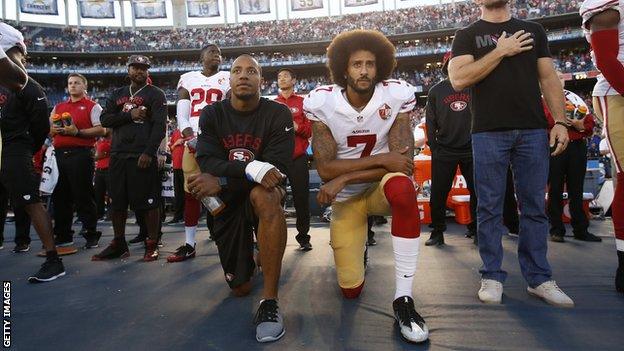 Colin Kaepernick kneels for the national anthem