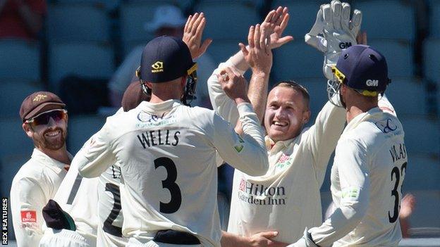 Matt Parkinson celebrates a wicket for Lancashire